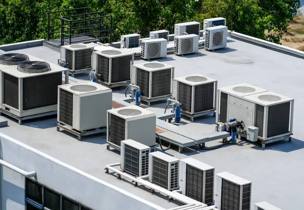 Technician servicing an HVAC air handling unit