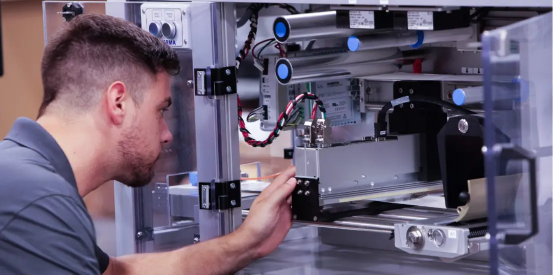 Technician servicing an HVAC air handling unit